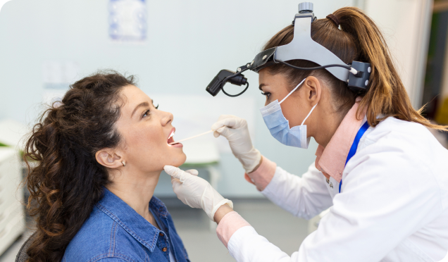 A woman receiving a dental check-up from a dental expert in Surrey, ensuring top-notch dental service with a focus on excellence.