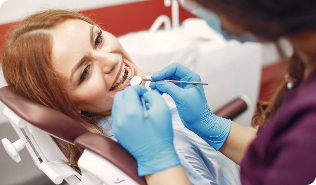 Dental Expert Conducting The Dental Implants Procedure On A Patient